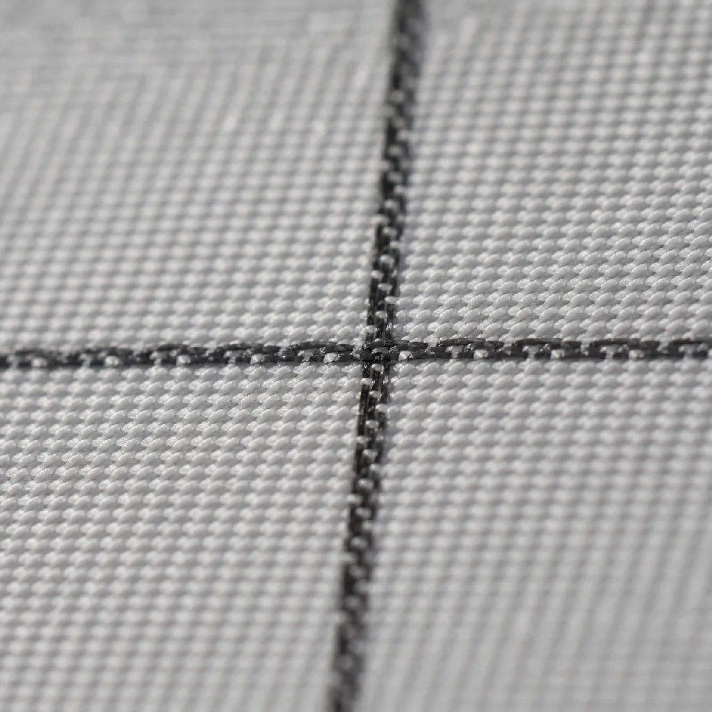 Macro close-up of the anti-static fabric grid, showing the fine conductive lines crossing the weave.